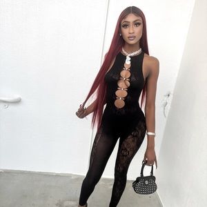 This lingerie jumpsuit is super cute with an all black lace design